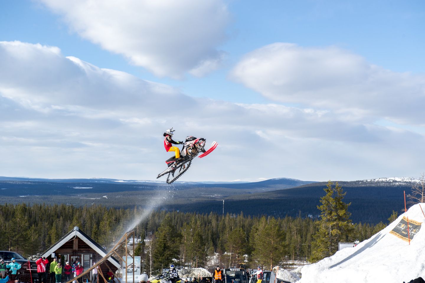 Snowcross snowmobile jump in Finnish Lapland