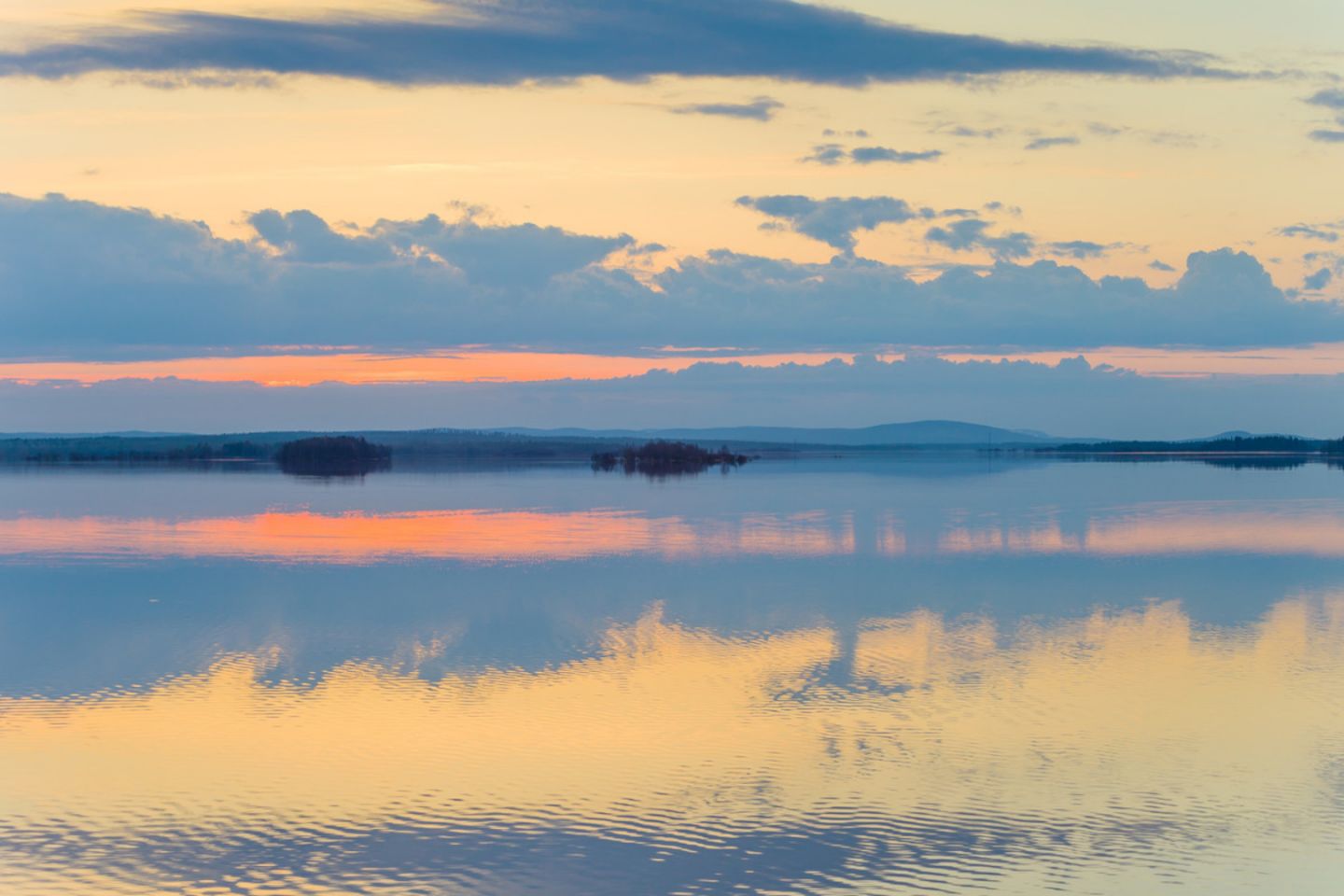 A sunset during a slow travel trip to Finnish Lapland in the summer