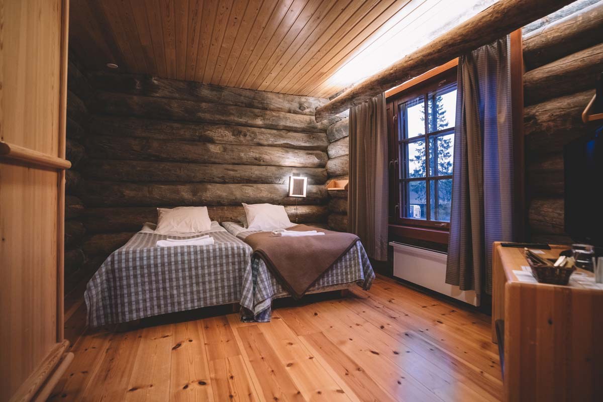 A log cabin room at Santa's Log Villa Borealis, a special winter accommodation in Luosto, Finland