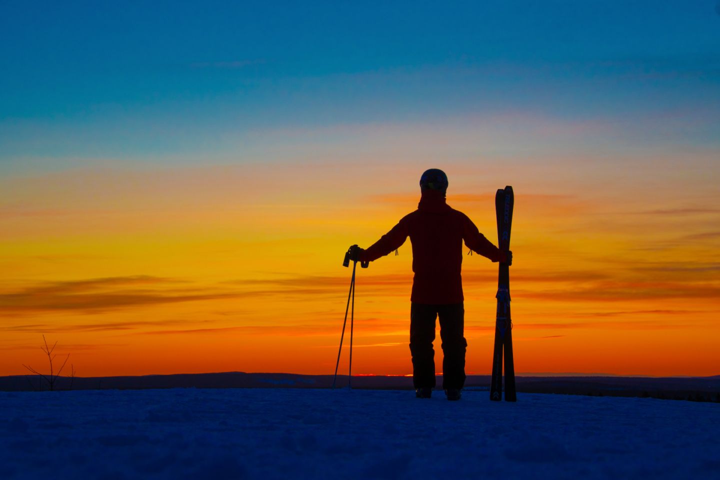 Enjoying an early sunset on a ski slope in Rovaniemi, Finland in winter