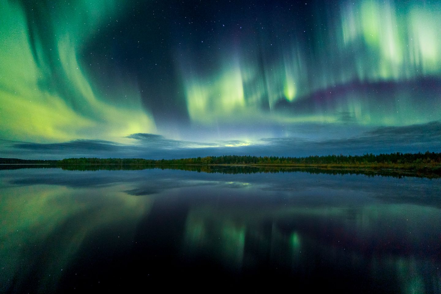 Northern Lights over a lake in Salla, Finland