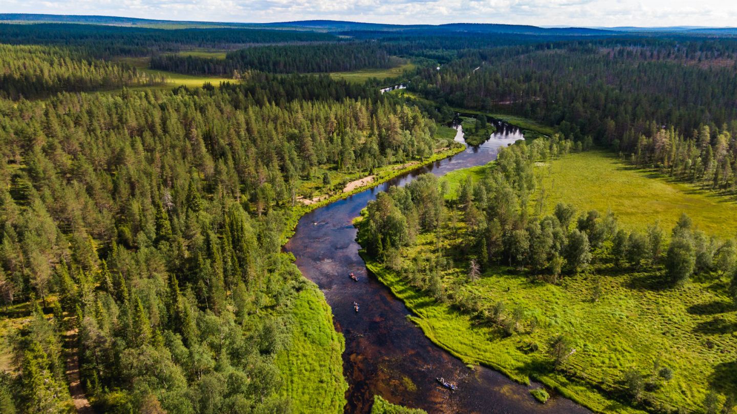 Paddling along the river in Savukoski, Finland