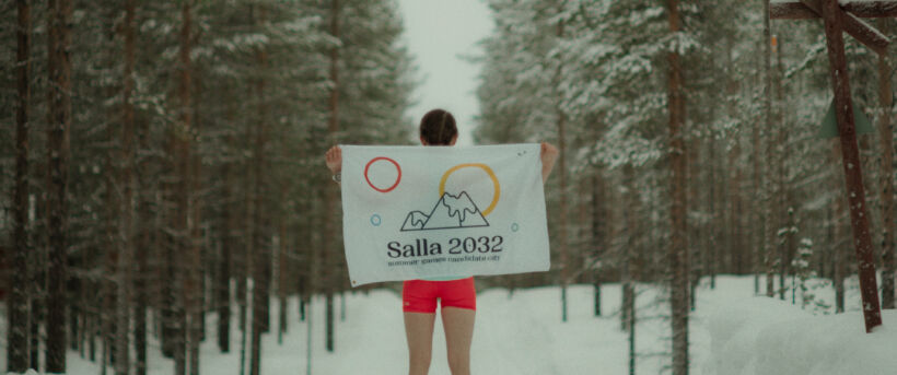 Person holding Save Salla flag