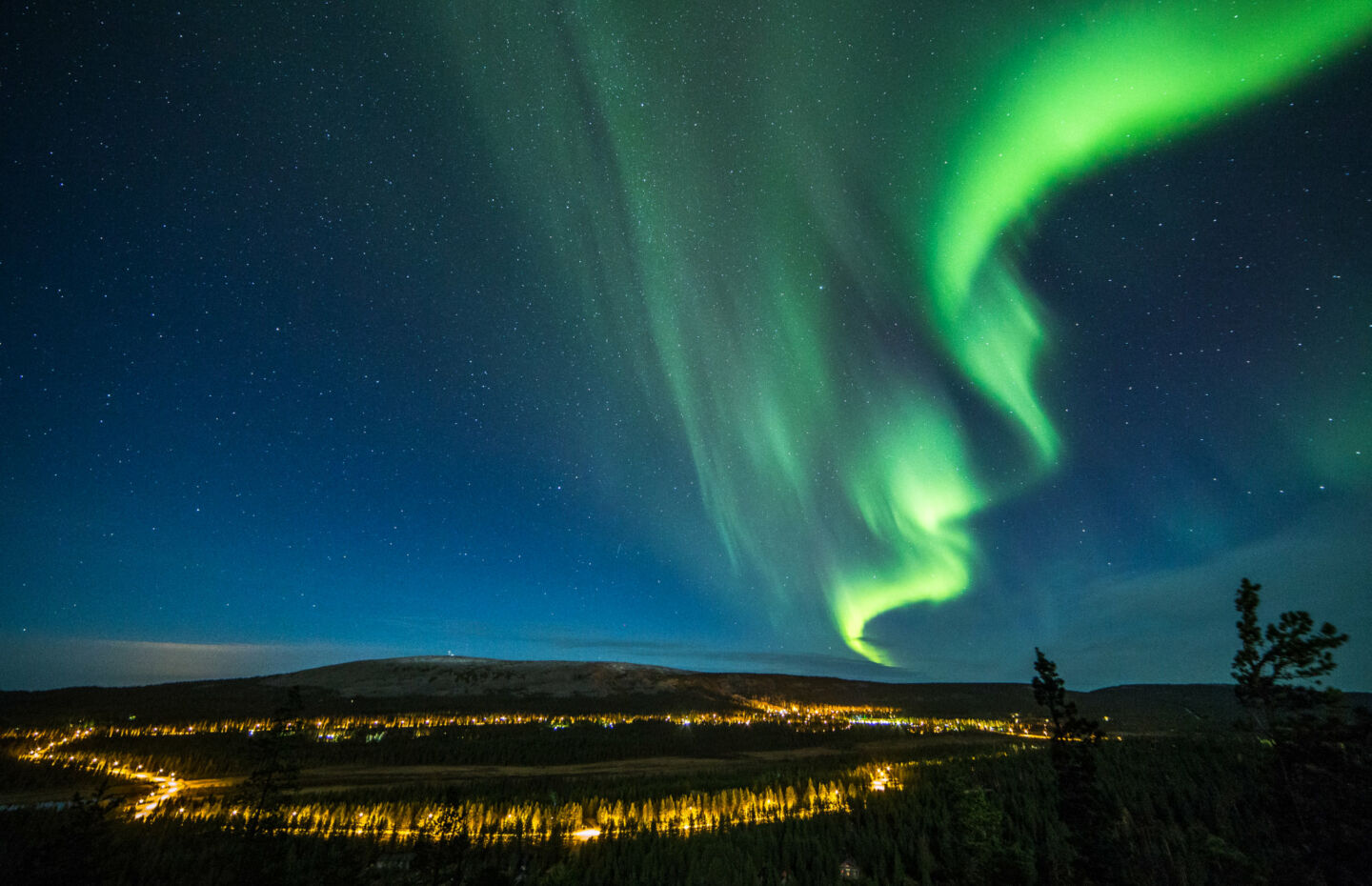 Arctic adventure - Northern Lights over Luosto ski resort in Finnish Lapland