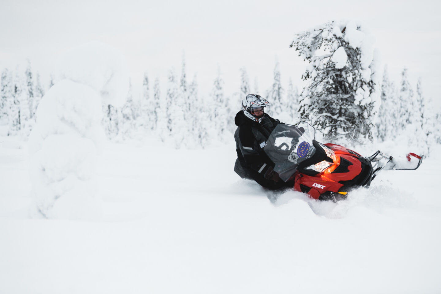 Snowmobiling in winter in Salla, FInland