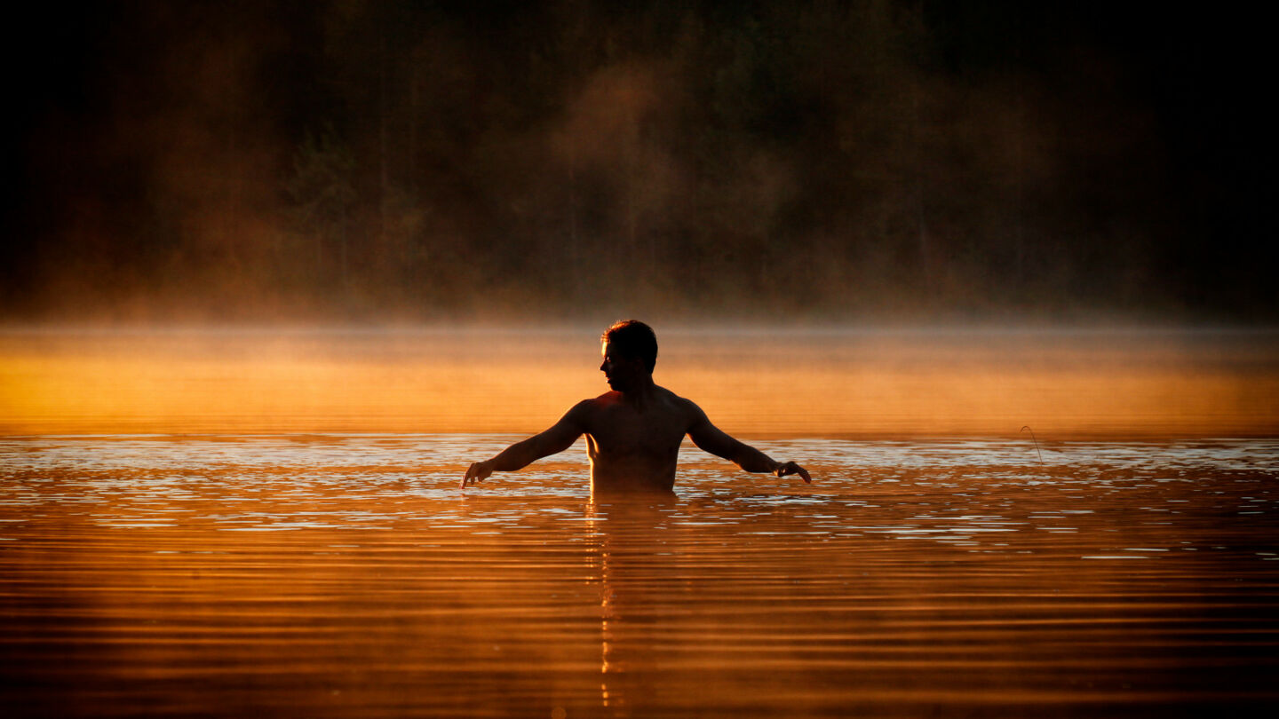 Swimming at sunset in Ruka-Kuusamo, Finland