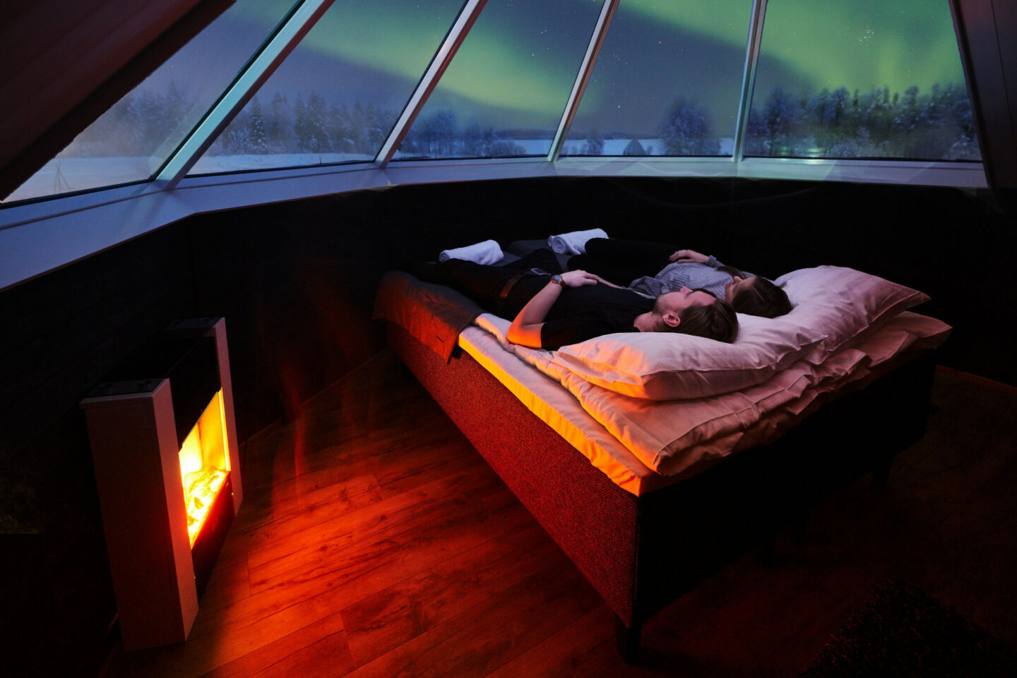 Sleeping in an aurora igloo