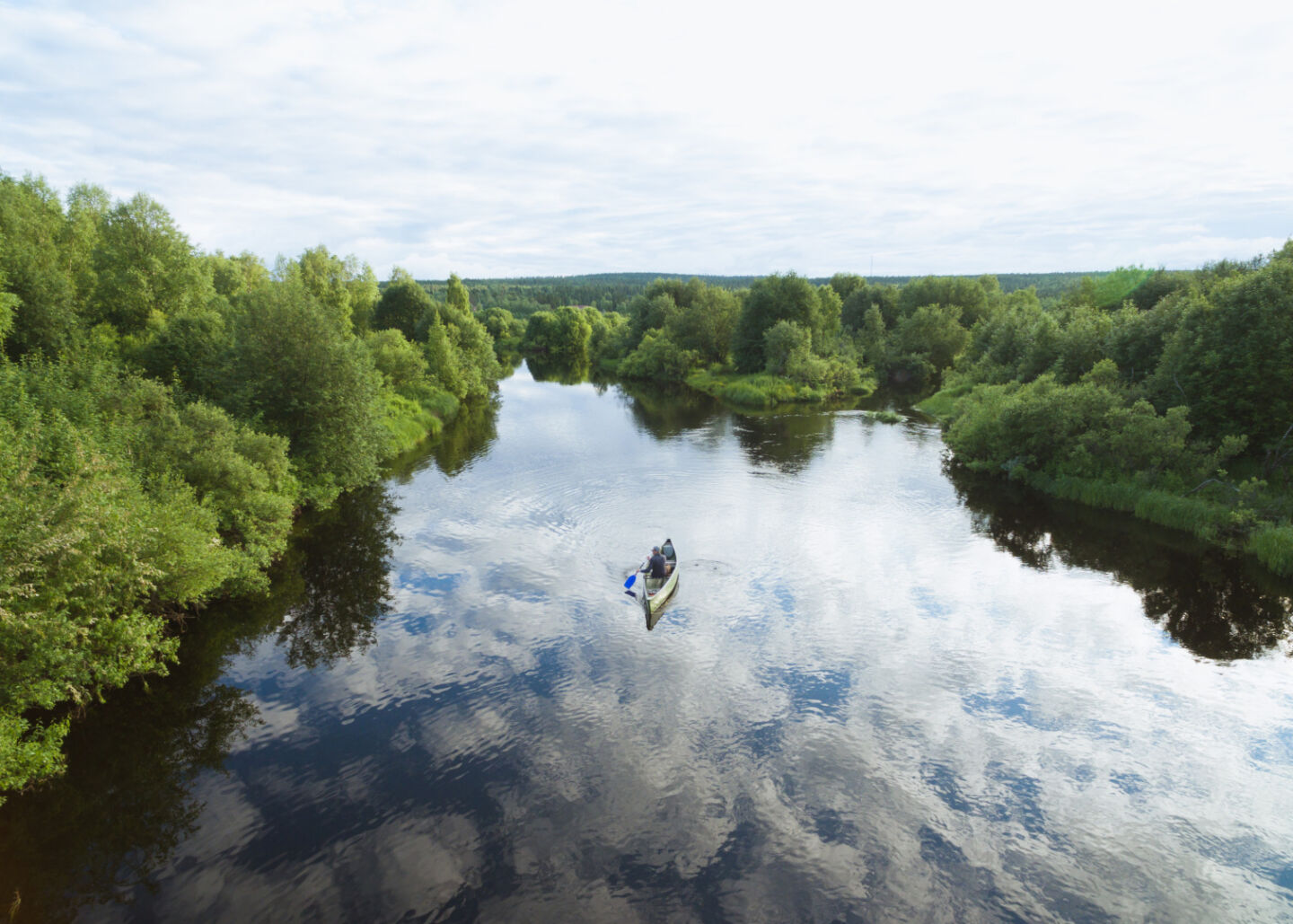 Drone shot of a canoe on the Ounasjoki river in Rovaniemi, Finland - Looking for drone rules, laws & regulations for Finland?