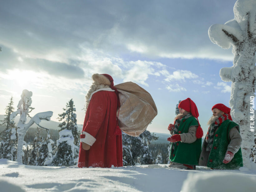 Santa and his elves survey Finnish Lapland in winter