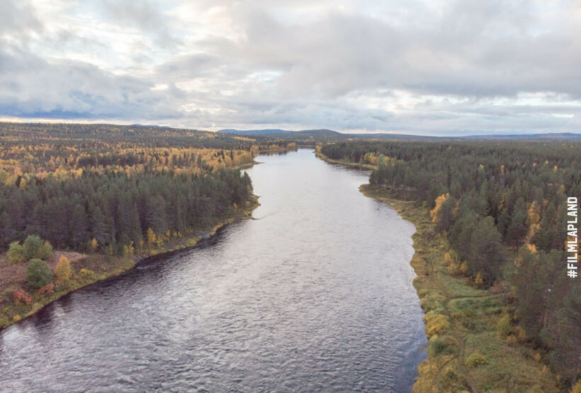 The river to autumn colors in Savukoski, Finland