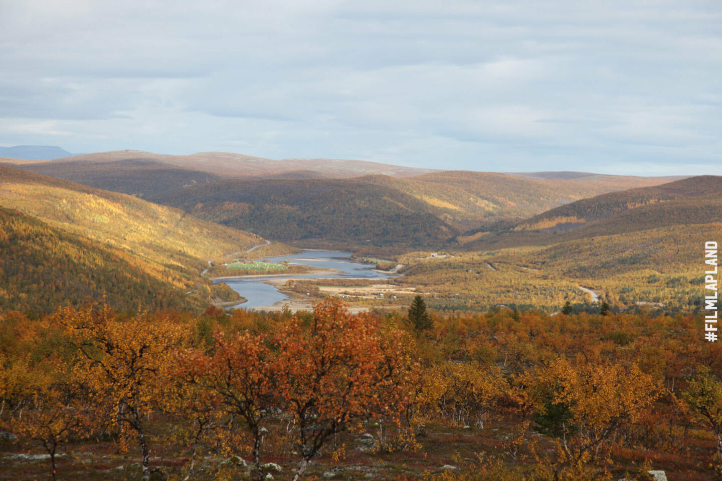 The sun shines down on Utsjoki, Finland and its autumn colors