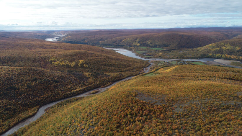 A scenic view of Karigasniemi in the colorful fall season. Karigasniemi is in Utsjoki, northern part of Lapland county, byt the Norwegian border. River Tenojoki flows next to it.
