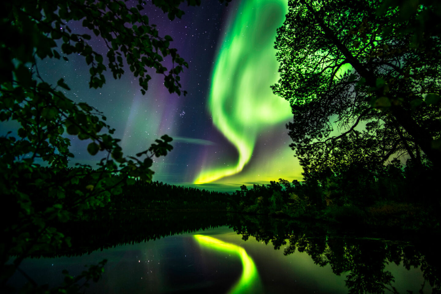 Northern Lights reflecting in Finnish Lapland