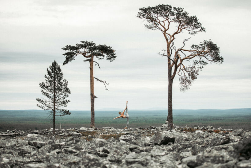 Doing yoga in a stone field in Lapland, Finland