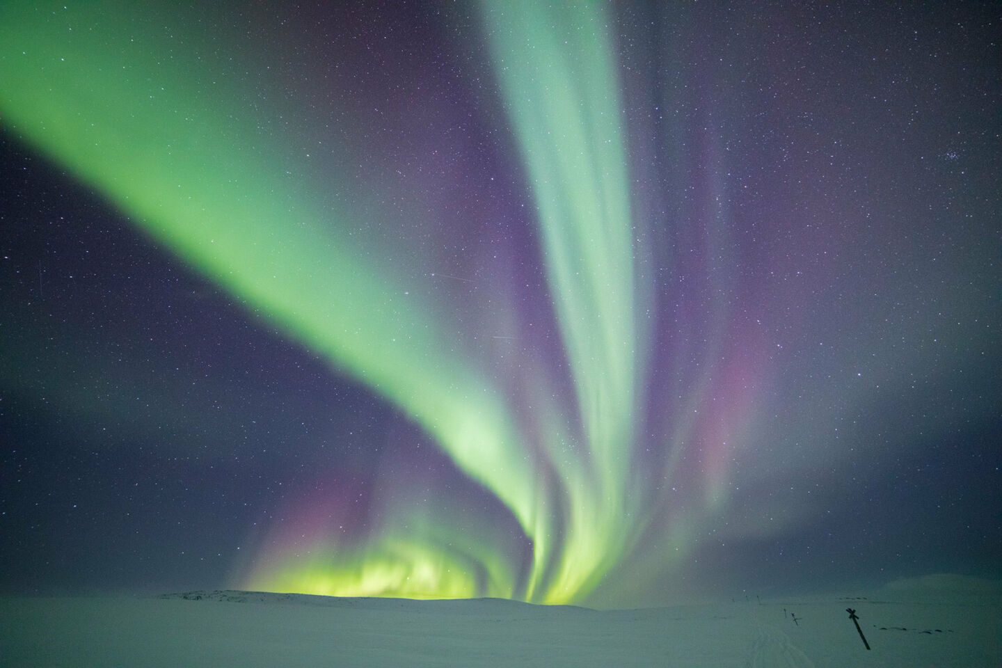 Northern Lights over the snow in Enontekiö, a Finnish Lapland filming location