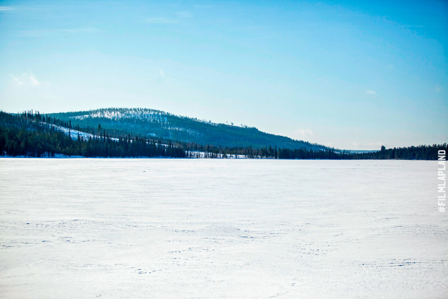 A frozen lake covered in snow, a Finnish Lapland filming location