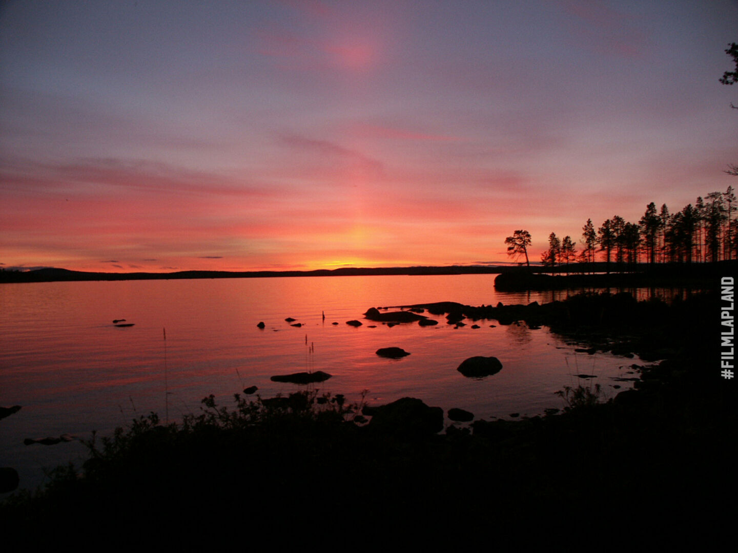 The midnight sun over Inari in summer, a Finnish Lapland filming location