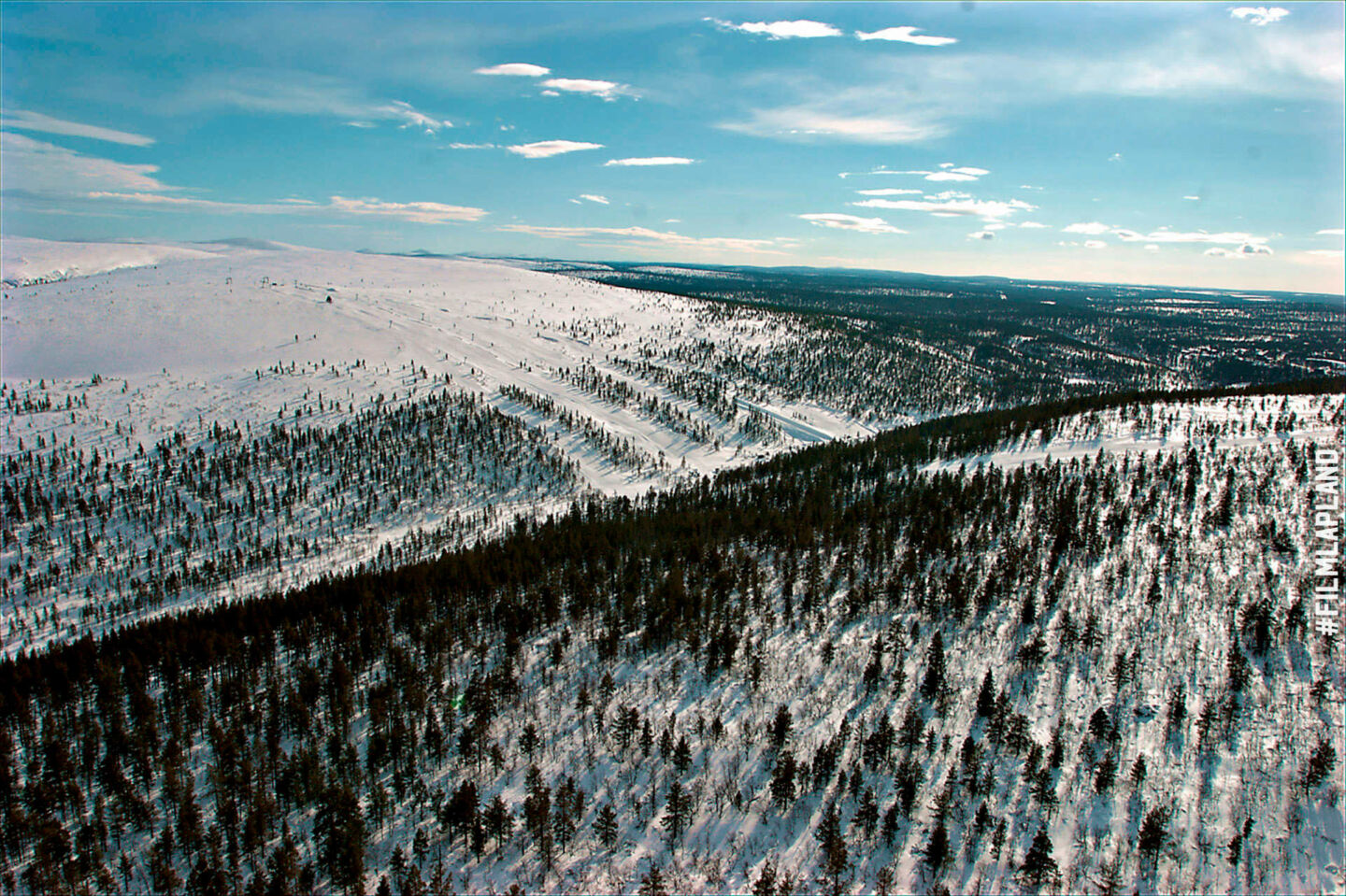 A snowy forest canyon in Inari, a Finnish Lapland filming location