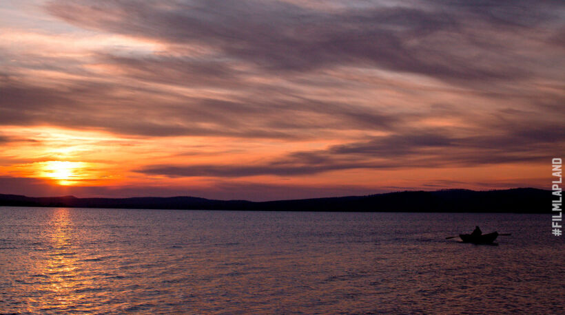 Midnight Sun over a lake in summer, a Finnish Lapland filming location