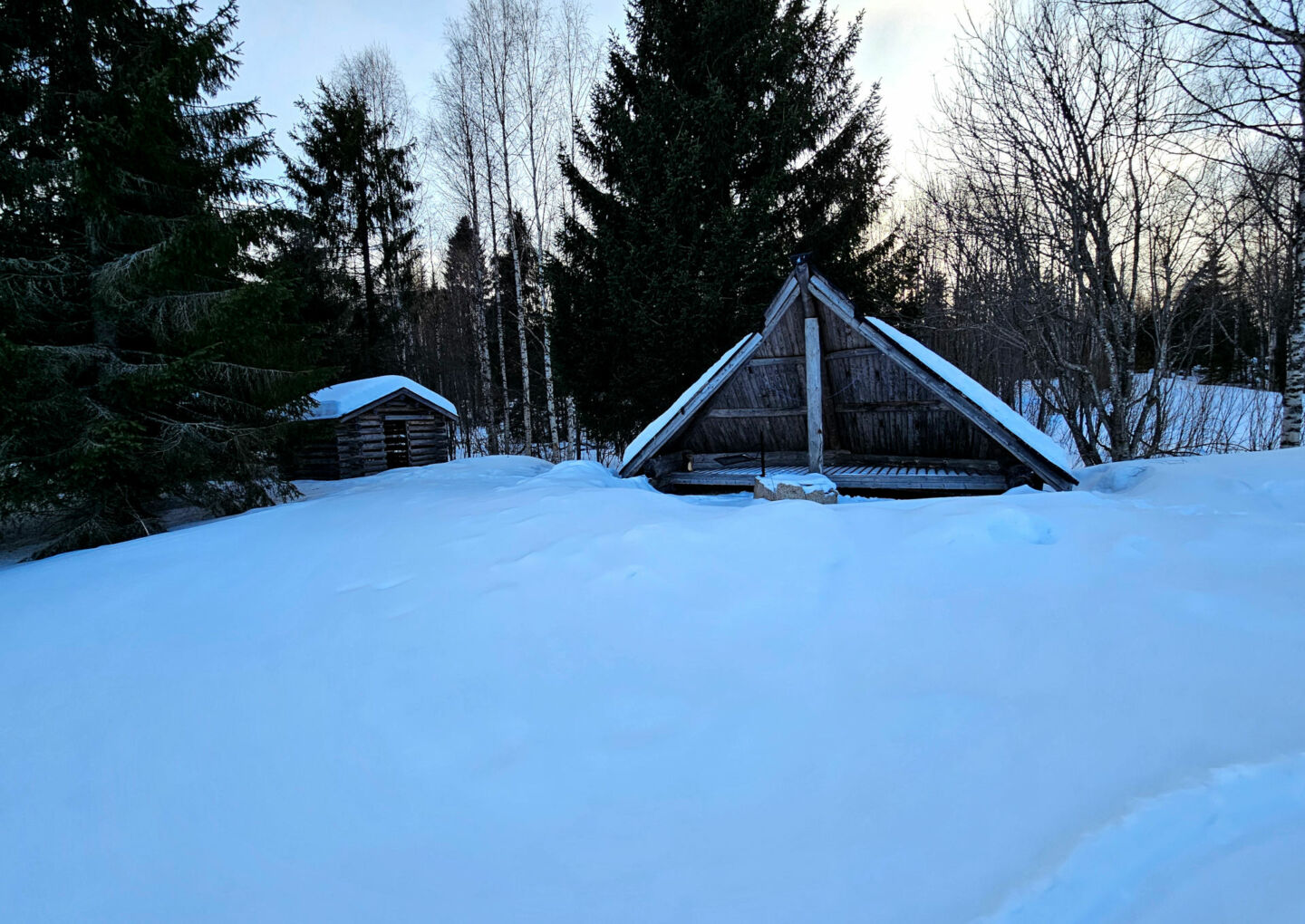 A winter view from a campfire laavu (hut) in Tervola, a riverside haven travel destination in Finnish Lapland